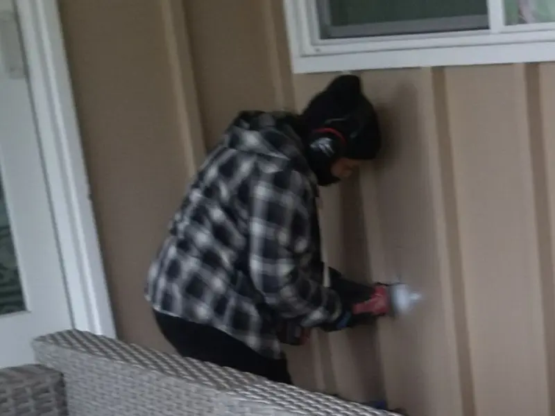 Professional electrician installing an exterior outlet in Albemarle