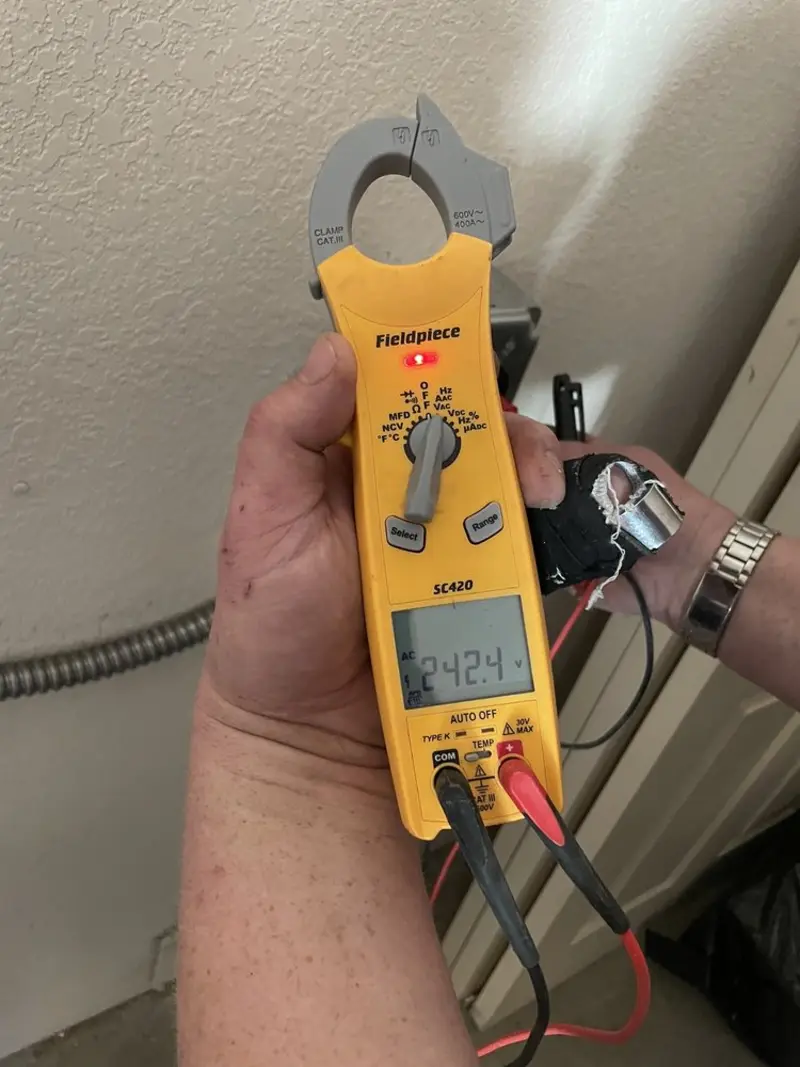 Voltage testing with clamp meter during Electrical Installation Services in Albemarle